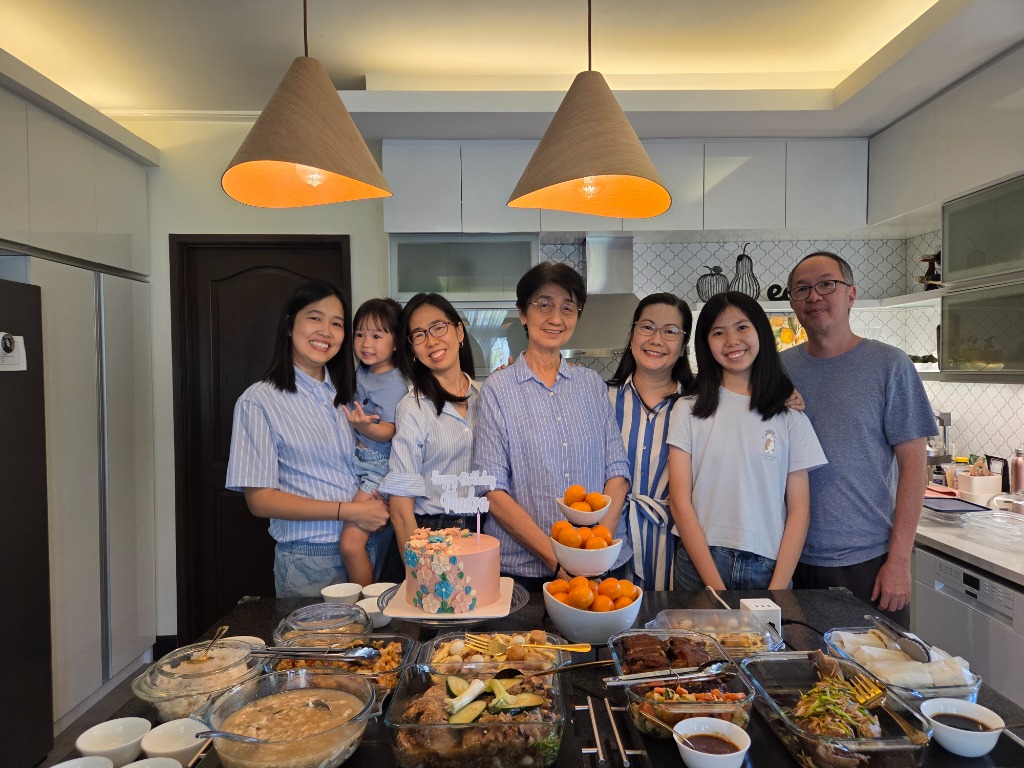 The whole family gathered around the sumptuous birthday feast and floral cake for Nene's 76th Birthday